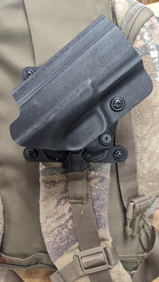 Backpack holster Securely carry your pistol on your backpack strap.
Fits straps up to 3 inches wide.
